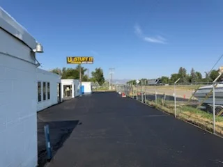Newly paved commercial asphalt lot with clean edges and dark surface finish
